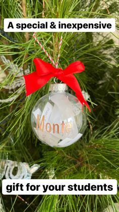 a christmas ornament hanging from a tree with the words monte written on it