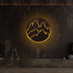 a wall mounted clock with mountains in the middle and a yellow light on it's side