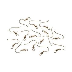 several pairs of fishing hooks on a white background