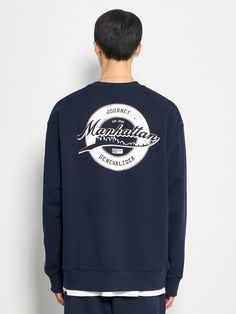 This is a comfortable and casual crewneck sweatshirt that is made out of sturdy cotton and polyester blend fabric. With a minimal yet unique design of graphic print on the back, logo embroidery on the front, and logo emblem embroidered on the left cuff, it gives a casual and trendy look. - Ribbed neckline, cuff, and hem- Graphic print on the back- Graphic logo embroidery on the front- Logo emblem embroidery on the sleeve- Relaxed silhouette Navy Cotton Crew Neck Sweater, Navy Cotton Sweatshirt With Logo Print, Navy Crew Neck Sweatshirt For Streetwear, Navy Cotton Sweatshirt With Embroidered Logo, Navy Crew Neck Sweater With Embroidered Logo, Urban Crew Neck Sweatshirt With Logo Print, Navy Casual Crew Sweatshirt, Navy Cotton Sweater For Streetwear, Navy Relaxed Fit Sweatshirt For Streetwear