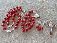 "Red beads catholic rosary for women and girls. Rosary handmade in Medjugorje using 8mm red Murano glass beads and red colored St Benedict crucifix. Every 10-th bead is St Benedict medal. Medals and crucifix made in Italy. Rosary is wearable. 70 cm ring - 26\" inches. ------------------------------------------ The rosary is packed in a transparent plastic bag with a Medjugorje motif on it. Custom gift card available for FREE - at the checkout - just send the text you want to be written on it. Te Cheap Red Rosary Bracelet For Gift, Red Beaded Rosary For Spiritual Use, Adjustable Red Rosary With 8mm Beads, Handmade Red Rosary For Jewelry Making, Red Adjustable Rosary With Round Beads, Adjustable Red Rosary With Round Beads, Adjustable Red Rosary, Adjustable Red Beaded Rosary, Spiritual Red Crucifix Rosary