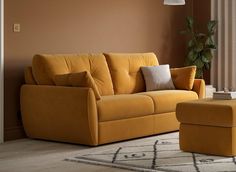 a yellow couch and ottoman in a living room