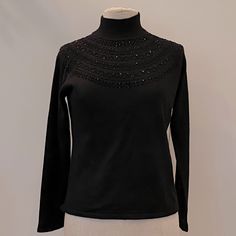 New Vintage Rena Rowan Black Turtleneck W Embellishment Around Neck. New With Tags Condition New Womens Size M Measurements 18 3/4 Pit-Pit 22 Length Acrylic / Wool Elegant Winter Tops With Sequins, Elegant Winter Sequin Tops, Elegant Sequined Winter Tops, Elegant Sequined Tops For Winter, Elegant Fall Tops With Embellished Collar, Elegant Fitted Top With Embellished Collar, Elegant Evening Top With Embellished Collar, Elegant Festive Winter Tops, Elegant Long Sleeve Embellished Tops