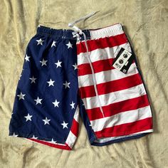 Men's American Flag Uzzi Swimsuit Size Large, Above The Knee, Tear Resistant, Water Resistant, Fast Dry White Beach Bottoms For 4th Of July, White Bottoms For 4th Of July Beach Outing, 4th Of July Beach Bottoms With Flag Print, Casual Beach Bottoms With Flag Print, Casual Bottoms With Flag Print For Beach, White Patriotic Bottoms For Summer, Casual Flag Print Bottoms For Beach, Patriotic White Bottoms For Summer, Casual 4th Of July Swimwear For Vacation