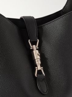 Gucci's 'Jackie' bag is one of the house’s most recognisable designs. This version has been crafted in Italy from full-grain leather and fitted with a logo-engraved piston clasp across the open top. It has an adjustable shoulder strap and can carry noise-cancelling headphones, keys and a paperback. Gucci Bucket Bag With Leather Handles, Gucci Luxury Bucket Bag For Daily Use, Daily Use Gucci Luxury Bucket Bag, Daily Use Luxury Gucci Bucket Bag, Gucci Shoulder Satchel For Everyday Use, Gucci Bucket Bag For Daily Use, Gucci Shoulder Bag For Everyday Use, Gucci Satchel For Everyday Use, Designer Gucci Bucket Bag With Detachable Strap