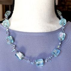 Description: Beautiful Venetian Murano Shimmering Icy Aqua Chunky Glass Bead Necklace With Amethyst-Colored Czech Beads And Silver Toned Embellishments. Handmade With Silver Chain And Hook Closure. Metal Looks Like Silver But Not Marked. Estate Sale. Excellent Condition. Dimensions: Necklace Length: 21” Thanks For Stopping By! Elegant Light Blue Single Strand Beaded Necklace, Elegant Light Blue Jewelry With Large Beads, Elegant Silver Crystal Necklace With Colorful Beads, Elegant Handmade Light Blue Necklaces, Elegant Handmade Light Blue Necklace, Elegant Light Blue Handmade Necklaces, Elegant Light Blue Beaded Necklace, Blue Glass Faceted Beads, Blue Glass Bohemian Necklace