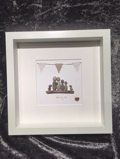 a white frame with a family picture on it