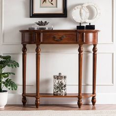 a wooden table sitting next to a potted plant