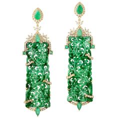 These stunning hand carved Jade earrings are thoughtfully and meticulously crafted in 18-karat gold. It is set in 25.24 carats Jade, 1.9 carats emerald and .90 carats of diamonds. FOLLOW MEGHNA JEWELS storefront to view the latest collection & exclusive pieces. Meghna Jewels is proudly rated as a Top Seller on 1stDibs with 5 star customer reviews. All items manufactured by us are handmade and can be customized or redesigned. Composition Size-67X19 Total Weight-16.481 Gold Weight(Gms)-10.745 Diam Vintage Emerald Earrings, Baguette Diamond Earrings, Carved Jade, Diamond Dangle Earrings, Jade Earrings, Gold Diamond Earrings, Colorful Jewelry, Jade Carving, Jade Jewelry