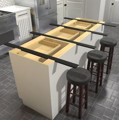 three stools sit in front of an island with four drawers and two barstools