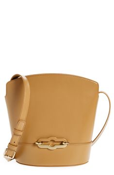 The label's Pimlico Lock is updated with a two-tone finish on this modern bucket bag crafted from smooth calfskin leather with an adjustable crossbody strap. Open top Adjustable crossbody strap Structured silhouette with flat base for stability Leather Imported Designer Handbags Calf Leather Bucket Bag With Smooth Grain, Modern Bucket Bag With Gold-tone Hardware In Calf Leather, Calf Leather Bucket Shoulder Bag With Smooth Grain, Chic Calf Leather Bucket Bag With Adjustable Strap, Formal Calf Leather Bucket Bag With Smooth Grain, Modern Calf Leather Bucket Bag With Leather Lining, Calf Leather Bucket Shoulder Bag With Palladium Hardware, Designer Calf Leather Crossbody Bucket Bag, Leather Bucket Bag