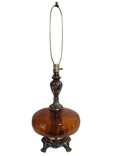 an old fashioned lamp is on display against a white background