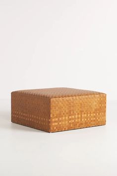 a wooden box sitting on top of a white table