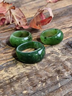 Solid Jade Band Ring, hand carved out of solid nephrite Jade from our mines in British Columbia, Canada. Available in sizes 5-13. Thickness is approximately 10mm. Please let me know if you need a size in between and we will try our best to find you the perfect fit. All our jade is 100% natural nephrite jade Green Carved Jade Rings, Carved Green Jade Rings, Jade Engagement Ring, Signet Ring Gold, Mali Garnet, Jade Charm, Kyanite Ring, Carved Ring, Astrology Chart