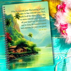 a notebook with an image of a tropical island