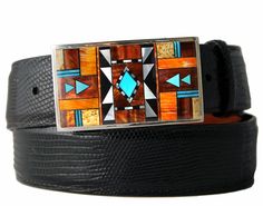 Stone inlay buckle set handcrafted in the Gallup, New Mexico studios of B G Mudd. The B G Mudd studios feature three generations of Native American stone workers, none of whom have less than 20 years experience in inlay and silverwork. Features hand-cut orange spiny oyster, tiger eye, white mother of pearl, turquoise, and onyx and set in sterling silver. Tom Taylor handmade leather belt straps are sold separately. Beaded Leather Belts Native American, Buckles Western, Custom Belt Buckles, Tom Taylor, Inlay Jewelry, Handmade Leather Belt, Native American Design, Custom Belt, Southwest Jewelry