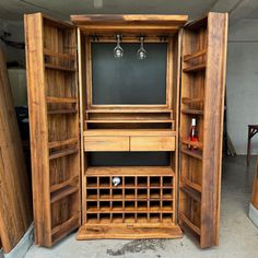 a wooden cabinet with wine bottles in it