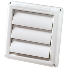 a white wall mounted exhaust fan with three rolls of paper on it's side