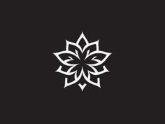 a black and white flower logo on a dark background