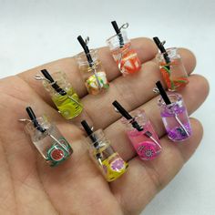 small miniature bottles filled with different colored liquids