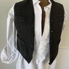 Welcome to The Textile Trunk ~ Please follow us on instagram! We are textiletrunk This handsome vest is French and dates from the very early 1900's ~ This is a teen's size, smaller than most ( or a small man ) This vest uses a wool, tweed fabric for the front a woven grey twill tweed~ It's really wonderful! ~ and it's backed in a satin cotton, black fabric. The inside lining is a striped cotton and a plain gray cotton ~ A very dapper vest! ~ ( vest E 624) MEASUREMENTS : This textile measures app Lace Apron, French Gray, Tweed Waistcoat, Tweed Vest, French Workwear, Men's Waistcoat, Embroidered Bodice, Vest Waistcoat, Wool Vest