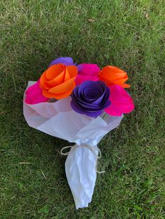 a bouquet of paper flowers on the ground