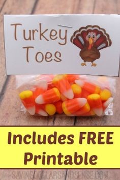 candy corn is wrapped in cellophane and placed next to a turkey toos sign