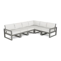 an outdoor sectional sofa with white cushions