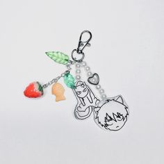 a key chain with two charms attached to it