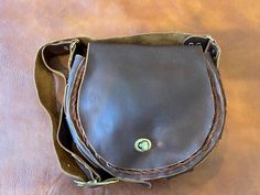 Three free leather gifts for first 20 customers. **Click into shop then announcements for details. Vintage Leather shoulder bag handmade. Vintage inspired from 1970s. Brown leather with brown leather lacing. Twist clasp. Bag is 10" wide x 8" tall. Adjustable shoulder strap. Should strap is set at 38" long and can be shortened or lengthened by 3". Handbag only. Please note handbag is hand made with minor imperfections in the leather that is part of the rustic and patina characteristics of the ite Clasp Bag, Leather Lacing, Leather Gifts, Bag Handmade, Vintage Leather, Style Vintage, Purses And Handbags, Leather Shoulder Bag, Leather Bag