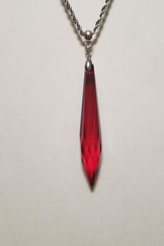 Beautiful Long Dark Red Glass Crystal  Teardrop Pendant Necklace 24 Inch Stainless Steel - Sparkly Braided Rope  Chain ?"OR"? - Box Chain ?"OR"? - ROLO Chain,  20 inch Chain on any of the 3 choices, just ask. Dark Red Crystal Glass Teardrop   Necklace Pendant - Glass Crystal Teardrop  Bead, Dark Red, it's a little heavy, 3 inch long  X 17/32 inch dia.  "Not Risen" - REAL GLASS Bead Pinch Bail & Necklace Connector Bail smaller Earrings come with most all the colors  Lead, Nickle, and Cadmium Free Long Drop Crystal Necklace For Gifts, Crystal Dangle Drop Necklace For Gifts, Simple Heart Necklace, Bottle Cap Necklace, Braided Rope, Free Earrings, Teardrop Beads, Teardrop Necklace, Teardrop Pendant