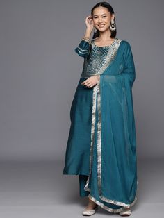 Blue Silk Blend Ethnic Motif Embroidered Suit Set with Silk Chiffon Dupatta Straight Chanderi Kurta With Embroidered Border, Straight Kurta Salwar Kameez With Embroidered Border, Chanderi Straight Kurta Set With Mirror Work, Chanderi Straight Kurta With Embroidered Border, Diwali Embroidered Palazzo Set With Straight Kurta, Festive Straight Kurta Sets With Embroidered Border, Festive Embroidered Palazzo Set With Straight Kurta, Navratri Straight Kurta Palazzo Set With Embroidered Border, Diwali Palazzo Set With Mirror Work And Straight Kurta