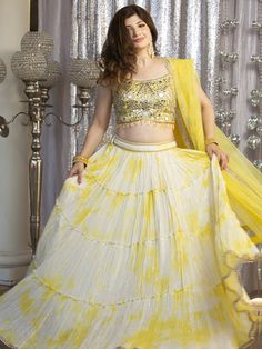 Go all out in this whimsical lehenga, studded with precious mirror, pearl, stone, embroidery work, which is sure to bring out the innate grace and grandeur in you! Color - Lemon Yellow Fabric & Work Style - - Silk blouse: mirror, pearl, stone, embroidery work. - Soft net lehenga: mirror, pearl, stone, embroidery work. - Soft net dupatta: embroidery work. Details - - Assured quality - Wash care instruction: Dry clean only. - Slight variation in color is possible due to digital photography. Navratri Hand Embellished Dupatta, Semi-stitched Hand Embellished Choli For Eid, Navratri Semi-stitched Hand Embellished Choli, Hand Embellished Semi-stitched Choli For Eid, Navratri Hand Embellished Semi-stitched Choli, Eid Semi-stitched Hand Embellished Choli, Hand Embellished Georgette Lehenga For Eid, Hand Embellished Georgette Choli For Eid, Eid Hand Embellished Georgette Lehenga