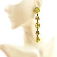 Long Yellow Rhinestone Dangle Earrings, Yellow Jewel Long Pierced Earrings, Jeweled Showgirl Earrings As the sun sets on a warm summer day, casting a golden hue over the horizon, these Long Yellow Rhinestone Dangle Earrings are the epitome of elegance. With a cascade of yellow jewels that dance delicately with each movement, these earrings are a true showstopper. Imagine wearing them to a glamorous gala, the soft glow of the evening lights reflecting off the rhinestones, making you the center of Green Linear Earrings For Parties, Yellow Dangle Crystal Earrings For Party, Yellow Dangle Crystal Party Earrings, Green Drop Earrings For Party, Elegant Yellow Crystal Earrings For Party, Yellow Drop Clip-on Earrings For Party, Elegant Yellow Crystal Dangle Earrings, Elegant Yellow Dangle Crystal Earrings, Elegant Yellow Dangle Clip-on Earrings