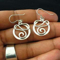 Handmade Sterling Silver Twisted Wire Earrings by forkwhisperer Everyday Sterling Silver Wire Wrapped Jewelry, Unique Nickel-free Sterling Silver Jewelry, Unique Sterling Silver Hoop Earrings For Pierced Ears, Unique Sterling Silver Hoop Earrings, Spiral Silver Plated Wire Earrings As Gift, Spiral Silver Plated Wire Earrings For Gift, Handmade Spiral Earrings For Everyday, Handmade Unique Sterling Silver Hoop Earrings, Handmade Spiral Earrings For Everyday Wear