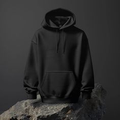 Mockup of Black Hoodie with Drawstrings on a Rock with a Plain Dark Grey Background Digital File Download. Basic Black Hoodie Sweatshirt, Basic Black Long Sleeve Hoodie, Black Long Sleeve Basic Hoodie, Black Techwear Fleece Hoodie, Black Fleece Techwear Hoodie, Basic Black Fleece Hoodie, Black Fleece Sweatshirt With Adjustable Hood, Black Hoodie With Double-lined Hood, Crew Neck, Black Band Merch Hoodie For Fall