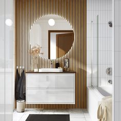 a bathroom with a sink, mirror and bathtub