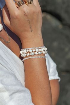 "This beaded bracelet features a collection of tiny white freshwater pearls to capture the enticement of Hawaii's white sand beaches. Wear this gold pearl bracelet alone or stracked for a classically elegant allure. ✦ DETAILS ✦ ✧ Name: Maile (MIE-leh) - vine. ✧ Adjustable Length from: 6\"-7.5\" Inches. ✧ White 3-4mm Freshwater Pearls. ✧ 14kt Gold Filled Components, Extender, and Clasp. ✧ All Ke Aloha Jewelry pieces come packaged thoughtfully, beautifully, and ready for gift giving. ✦ MORE GOLD B Puka Bracelet, Luxurious Bracelet, Dainty Pearl Bracelet, Gold Pearl Bracelet, White Pearl Bracelet, Simple Hoop Earrings, Tropical Escape, Puka Shell, Shell Bracelet