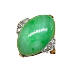 This is a stunning antique Art Deco Jade, Diamond and Platinum atop 14 Karat Yellow Gold Ring. The Wedding Ring, Engagement Ring or Cocktail Ring with a superb natural oval Jade Cabochon of great beauty is accented by 6 sparkling White Diamonds set in beautiful milgrain beaded borders in Platinum. The large oval jade cabochon is an exquisite gem. The jade is 19mm by 13mm by 7mm deep. On either side of the jade are three round diamonds each individually set in milgrain beaded borders in Platinum. The elegance of the diamond setting contrasting with the green of the jade is absolutely exquisite. The ring shank is 14 Karat Gold. The combination of the gorgeous jade, diamonds, platinum, and the wonderful form are the epitome of elegance. The ring is a classic jewel from the Art Deco period and Ring Shank, Platinum Diamond Rings, Antique Wedding, Wedding Engagement Ring, Ring Antique, Jade Ring, Diamond Settings, Art Deco Engagement Ring, Platinum Ring