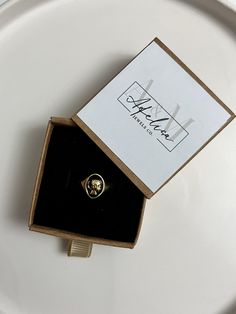 the main material of this ring is gold plated brass. It is an adjustable model and suitable for all sizes. The ring is sent in the box shown in the image. Victorian Gold Initial Ring As Gift, Vintage Yellow Gold Midi Rings For Wedding, 14k Gold Tarnish-resistant Crystal Ring As Gift, Tarnish Resistant 14k Gold Crystal Ring As Gift, Tarnish-resistant 14k Gold Crystal Ring For Gifting, Gold Victorian Signet Ring For Promise, Gold Victorian Style Signet Promise Ring, Gold Brass Crystal Ring For Gifting, Gold Brass Crystal Ring Gift