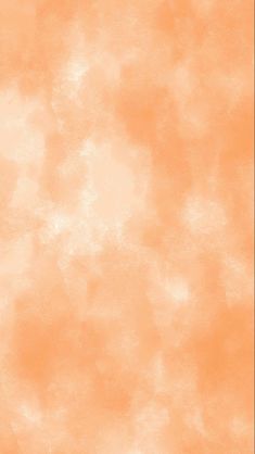 an orange background with some white clouds in the sky