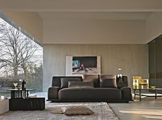 a living room filled with furniture next to a large glass window covered in frosting