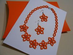 Necklace, earrings Tatted lace jewelry set orange READY TO SHIP Gift wrapped New Particular, special, handmade jewelry for festive occasions    Delicate lace made of pure cotton thread. Unique handmade tatted jewelry set , necklace with earrings made out of  orange cotton thread with added  pearls.      Many hours of handwork are woven into this beautiful jewelty     My handcrafted made with a lot of love and skill acquired over the years.    Jewelry set made of thread using the tatting or  frivolite technique. Circles and arches are formed with the help of a needle or a chunk ( shutle ) for frivolites, and different shapes can be obtained by combining these elements. This technique is used to make smaller laces, collars, jewelry ...  Jewlry set made out of  orange string with added WHITE Handmade Coral Jewelry For Party, Handmade Orange Jewelry For Celebration, Tatted Jewelry, Orange Necklace, Lace Necklace, Lace Jewelry, Tatting Lace, Handmade Lace, Lace Making