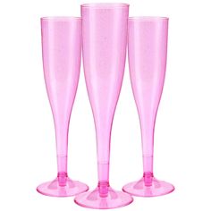 three pink wine glasses sitting next to each other