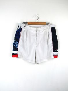 Fila vintage 90s tennis shorts, white with blue, red and white side bands Made in Italy Size L (pay attention to the measurements!) Measures Waist width: 42cm Thigh width: 34cm Crotch height: 30cm Total length: 38cm Condition: It is in excellent condition, it only has some small stains on the back and the "F" in Fila is slightly worn Our garments are all vintage and second hand. Any signs of wear or defects are documented with photos and description. For any questions, photos, videos we are at y White High-waisted Athletic Shorts With Built-in Shorts, White 90s Style Shorts For Summer, White 90s Style Summer Shorts, Summer Tennis Bottoms Short Length, White Tennis Bottoms With Built-in Shorts, Sporty White Summer Shorts, Retro White Bottoms For Summer, Summer Cotton Tennis Shorts, Retro White Shorts For Spring