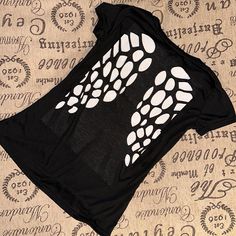 Laser Cut Out Wings On All Black Shirt. No Tags. Size Is About A Medium. White Paper In Shirt For Pictures To Show Cut Outs. Never Worn. Please See Pictures As They Are Part Of The Description. Black Cotton Blouse With Graphic Print, Black Graphic Print Crew Neck Blouse, Black Crew Neck Blouse With Graphic Print, Black Graphic Print T-shirt For Night Out, Stretch Black Blouse With Graphic Print, Casual Black Blouse With Graphic Print, Trendy Black Crew Neck Blouse, Edgy Black Stretch Blouse, Black Graphic Print Top For Night Out