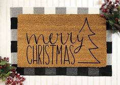 a merry christmas door mat on the wall