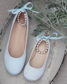 "THIS LISTING IS AVAILABLE IN WOMEN & KIDS SIZES Satin flats with gorgeous row of pearls and rhinestones ankle strapfor comfort and simple chic style. You can choose at checkout to do pearls ankle strap with SILVER BEADS OR GOLD BEADS MATCHING BRACELET & NECKLACE IS AVAILABLE, PLEASE CLICK LINK: https://www.etsy.com/listing/483923578/silver-pearls-bracelet-necklace-with?ref=shop_home_active_2&frs=1 DETAILS: COLORS AVAILABLE: White, Off white, Blush, Black, Light Blue, Champagne and W Elegant Blue Closed Toe Ballet Flats, Elegant Blue Ballet Flats, Flower Girls Shoes, Simple Chic Style, Shoes Light Blue, Bridesmaids Shoes, Silver Pearl Bracelet, Flower Girl Shoes, Bridal Flats