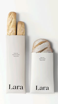 two baguettes sitting next to each other on a white surface