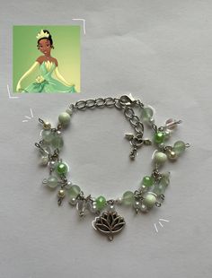 this bracelet was inspired from the movie Princess and the Frog :) it's supposed to look like tianas green dress that she wore, I tried to include all the colors! Here's a few things of how to take care of this bracelet, it's super simple * please don't get this bracelet wet, like putting water on it or any other liquid * also handle it gently when putting it on and off your wrist :) Princess Tiana Gift Basket, Disney Princess Inspired Jewelry, Disney Princess Inspired Bracelets, Princess And The Frog Bracelet, Whimsical Green Beaded Bracelets, Princess And The Frog Jewelry, Tiana Bracelet, Disney Princess Bracelet, Bead Fairy